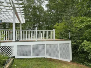 Decking Pergola Project with white lattice skirting and railing